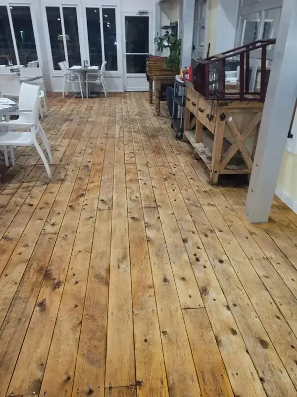 Cleaned wood plank floor in a restaurant